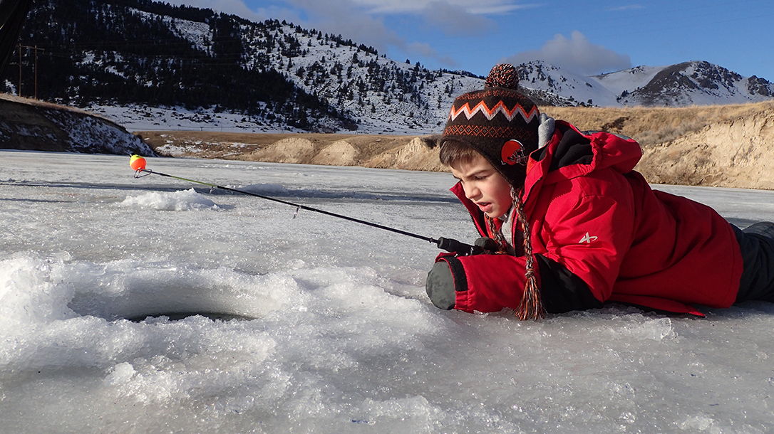 ice fishing, ice hole, boy with a fishing pole