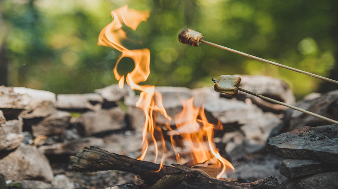 Cooking marshmallows over a campfire is a family tradition.