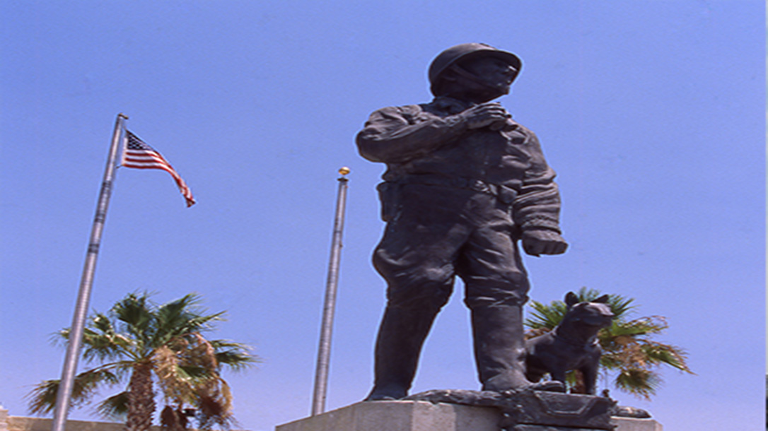 A statue of General George Patton and his dog in front of the museum in California.