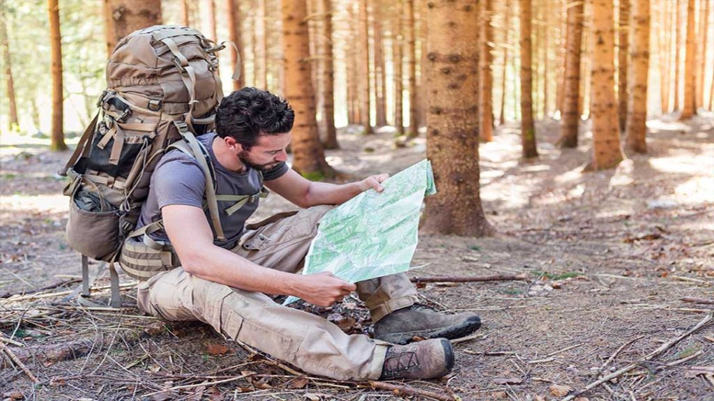 Using a map and understanding basic navigation can help you from becoming lost in the woods.